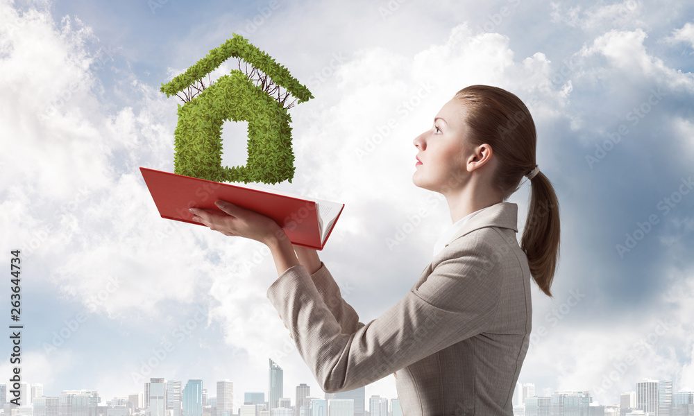 Woman with green plant shaped house