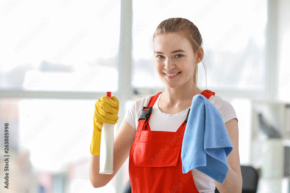 Female janitor cleaning office