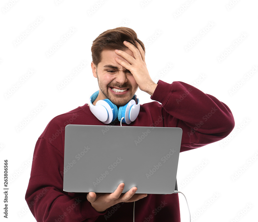 Stressed male programmer with laptop on white background