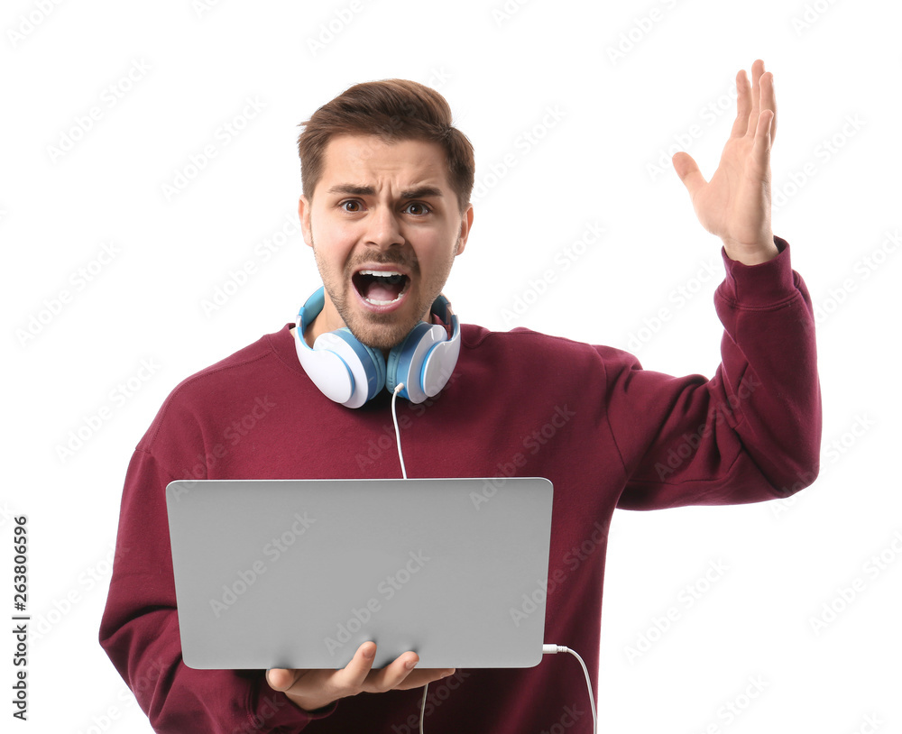 Stressed male programmer with laptop on white background