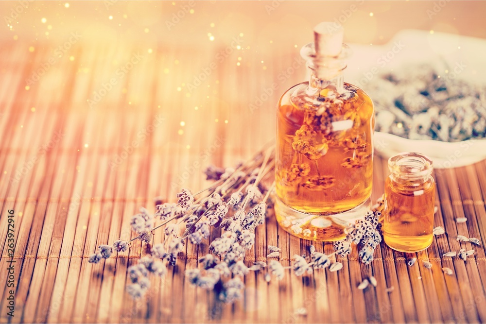 Lavender flowers and glass bottle isolated