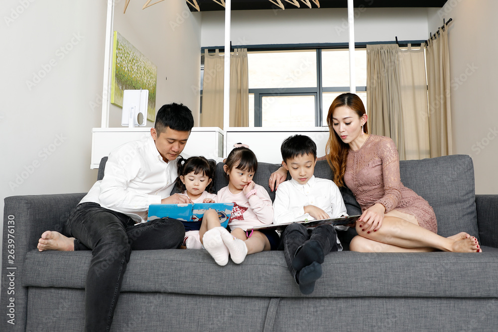 Parents Child Family father mother daughter son sit on sofa reading writing study teaching