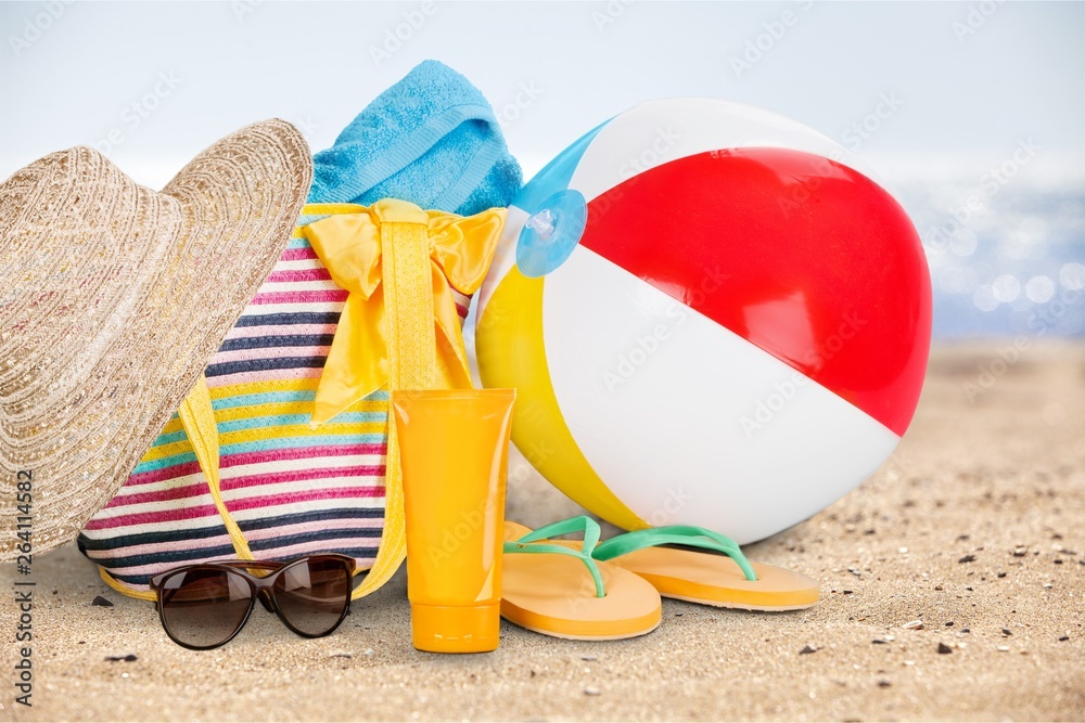 Beach Ball, Suitcase, Towel, Sun Hat, Flip-Flops and Sun Cream