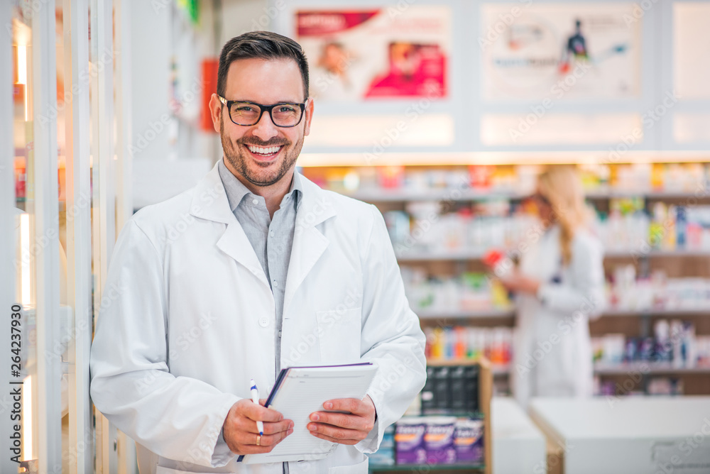 Cheerful pharmacist at work.