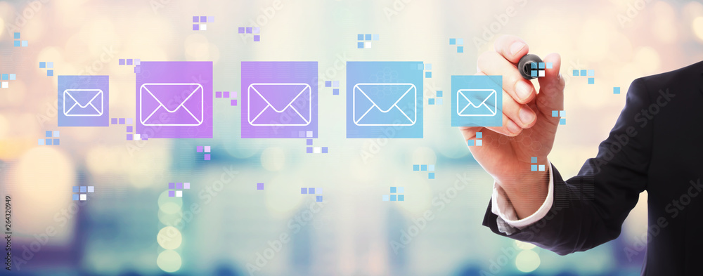 Emails with businessman on blurred abstract background