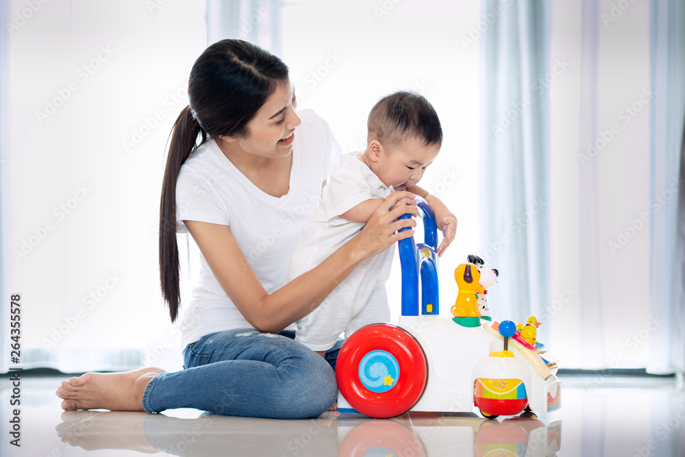 Asian mother traning walking to her baby