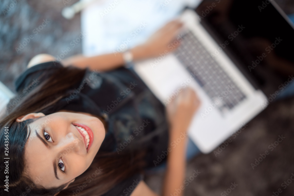 Asian lady student use computer notebook