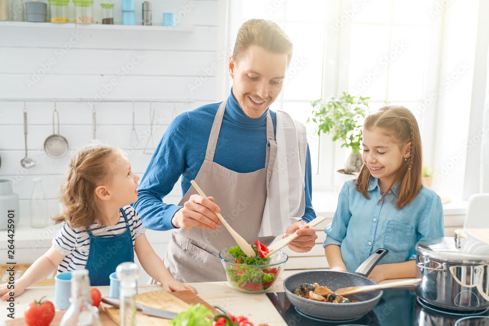 Happy family in the kitchen.