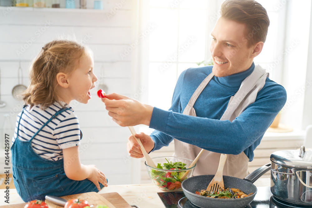 Happy family in the kitchen.