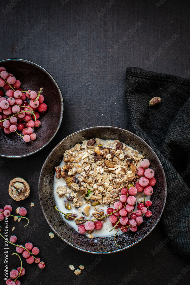 Granola with soy milk and redcurrants