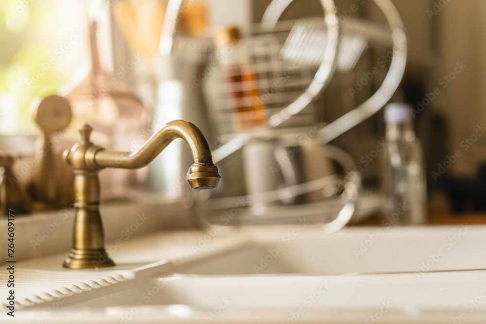 close up old style sink with copper water tap in country style decoration home ideas concept