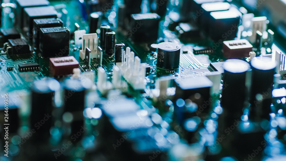 Close-up Macro Shot of Electronic Printed Circuit Board with Microchips, Transistors, Semiconductors