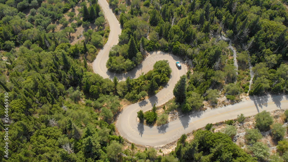 TOP DOWN: Flying above the blue SUV navigating the hairpin turns in Lefkada.