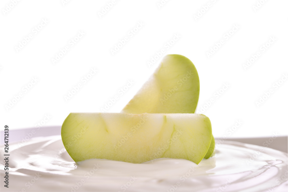 Plain yogurt with fresh fruit on top in bowl isolated on white background