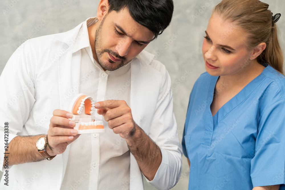 Dentist and nurse assistant working in dental office at the hospital. Dentistry concept.