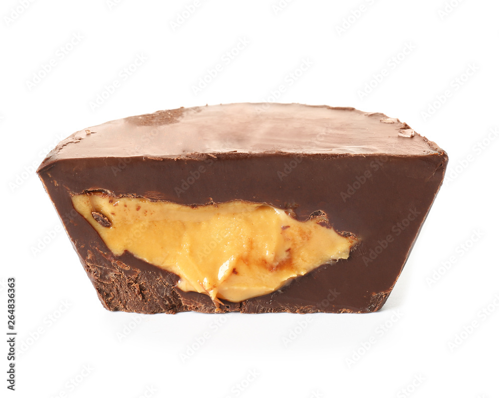 Tasty chocolate peanut butter cup on white background