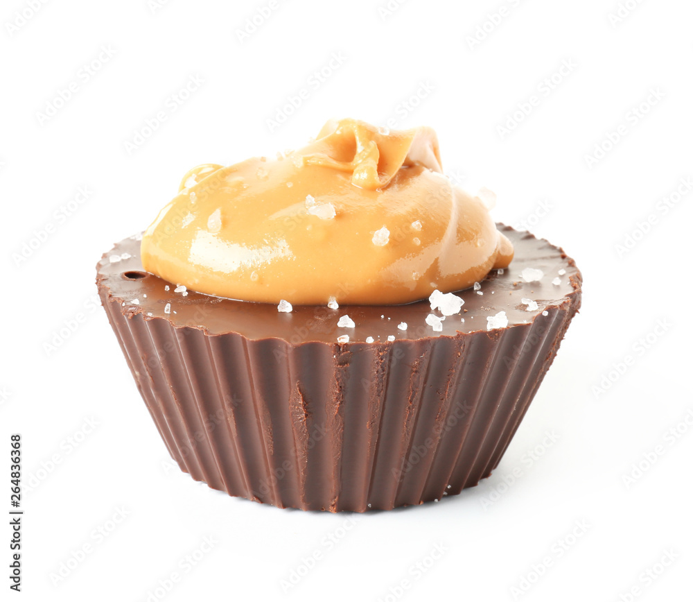 Tasty chocolate peanut butter cup on white background