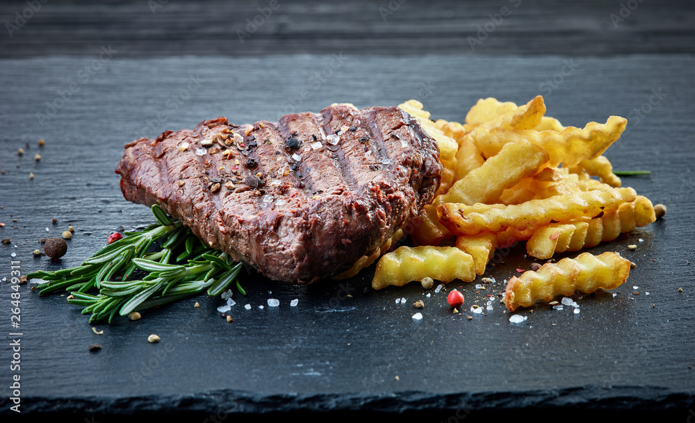 grilled beef fillet steak and fried potatoes