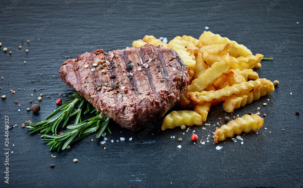 grilled beef fillet steak and fried potatoes