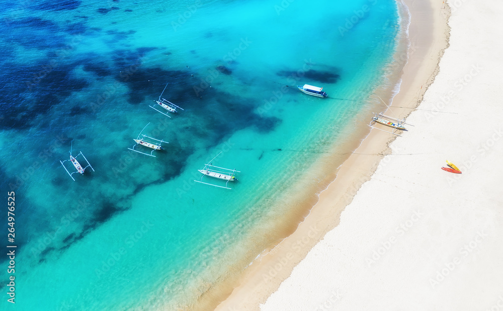 Boats on the water surface from top view. Turquoise water background from top view. Summer seascape 