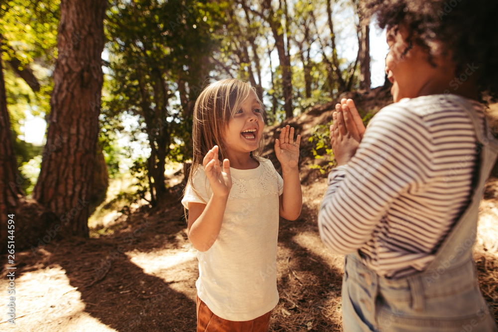 Cheerful girls playing clapping games