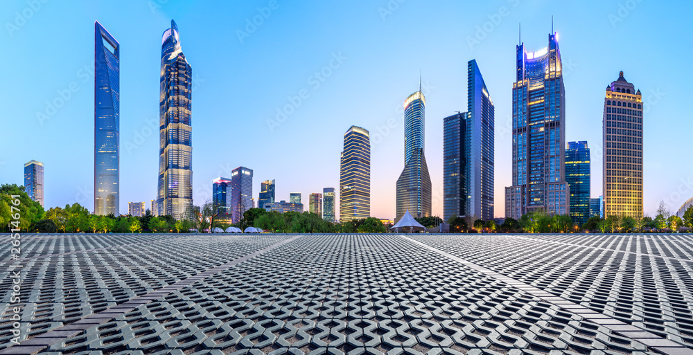 Shanghai modern commercial office buildings and square floor at night,panoramic view