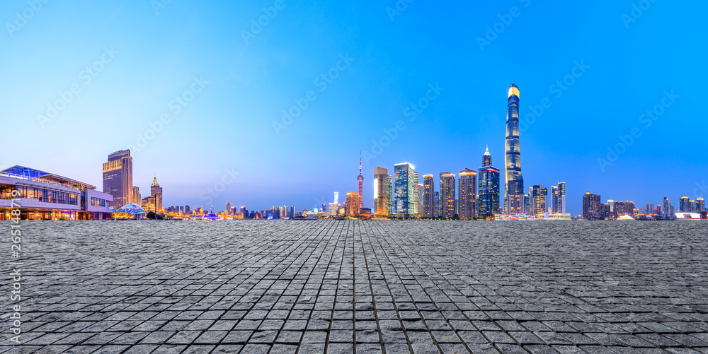 Shanghai modern commercial office buildings and square floor at night,panoramic view