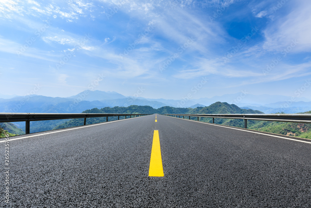 Straight highway and beautiful mountain natural landscape