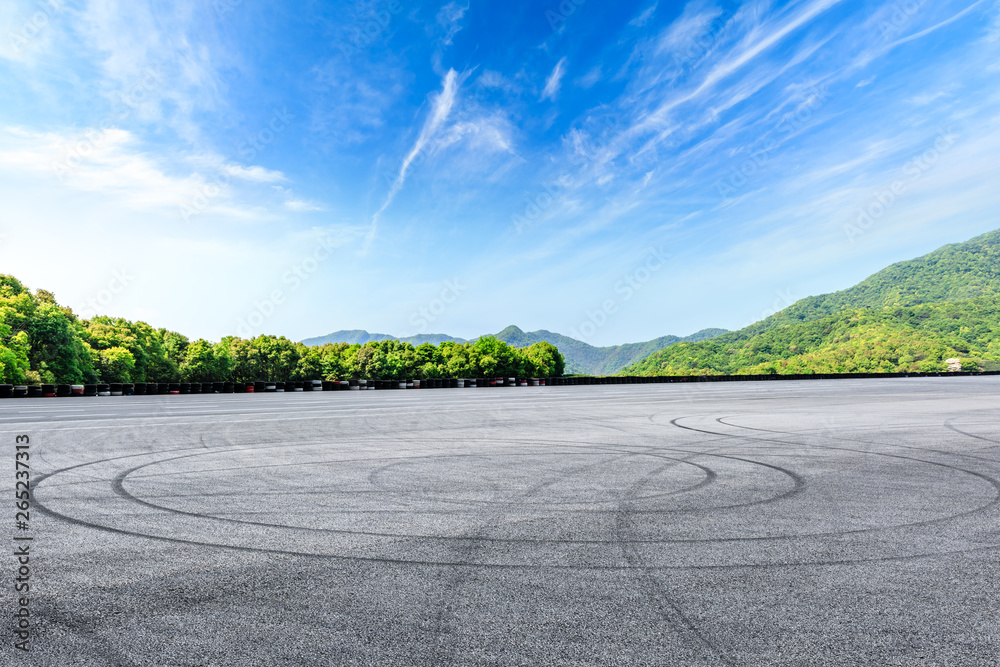 Empty asphalt race track and beautiful natural landscape