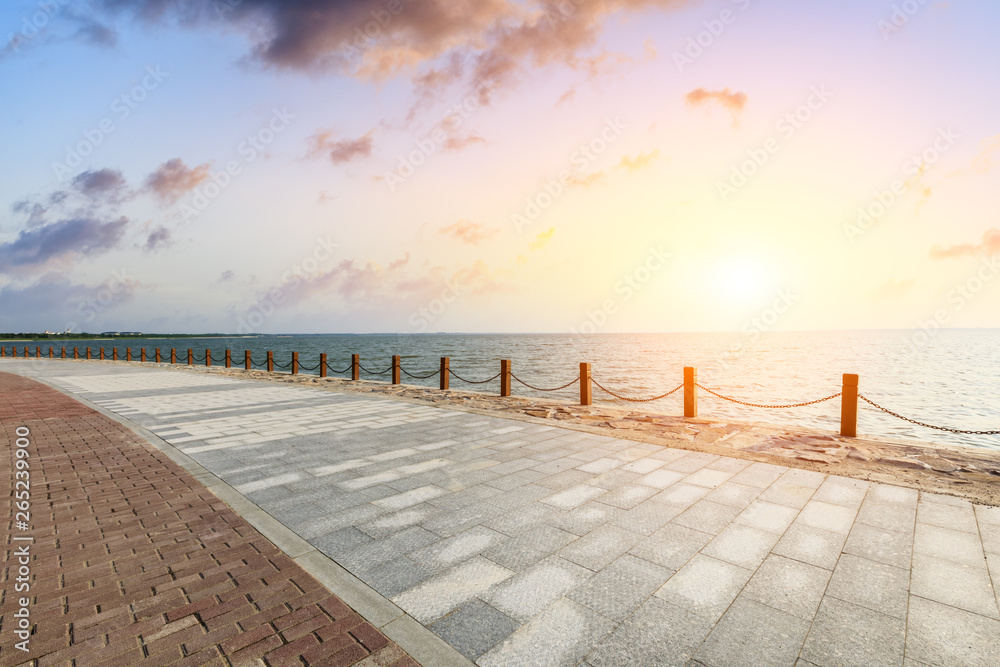 Beautiful lake and walkway with sky clouds at sunset