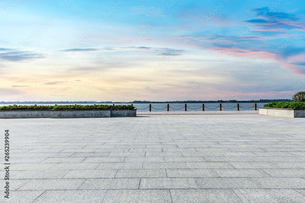 Beautiful lake and walkway with sky clouds at sunset