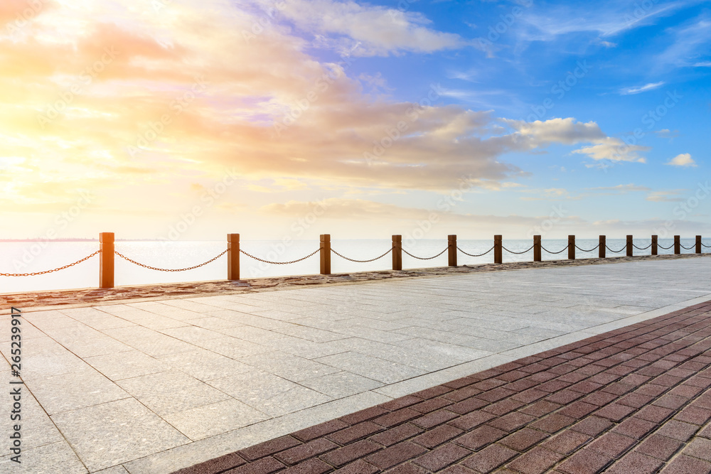 Beautiful lake and walkway with sky clouds at sunset