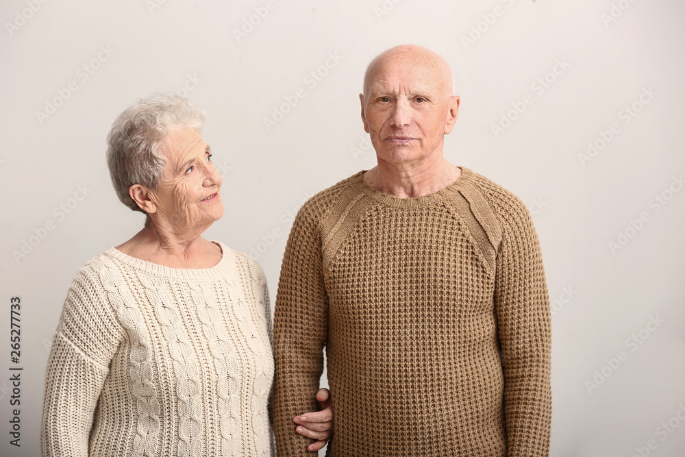 Portrait of senior couple on white background