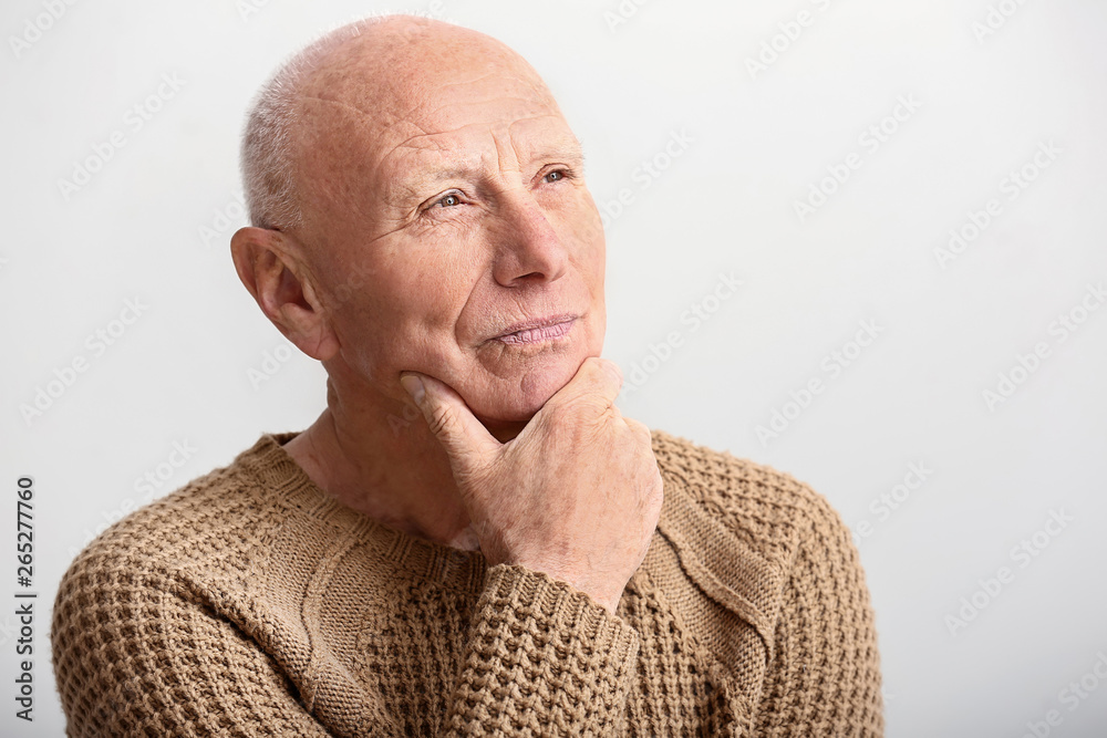 Portrait of senior man on white background