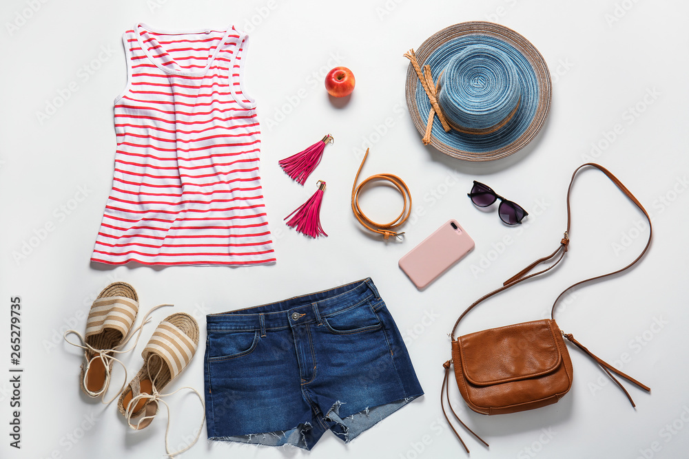 Set of female clothes and accessories on white background