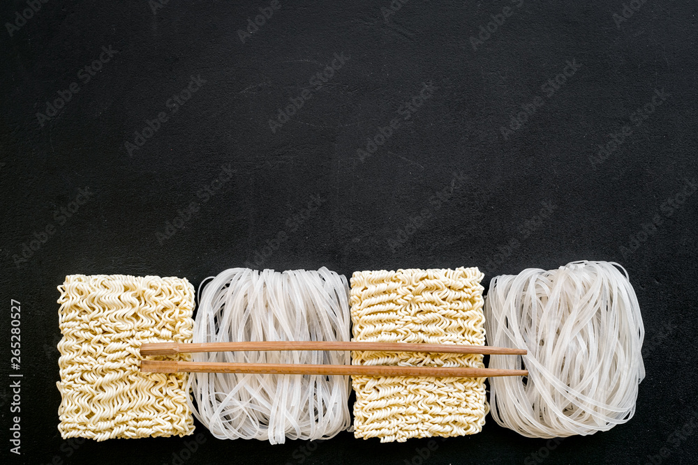 Rice vermicelli, noodles to cook Chinese and Japanese food design on black background top view copy 