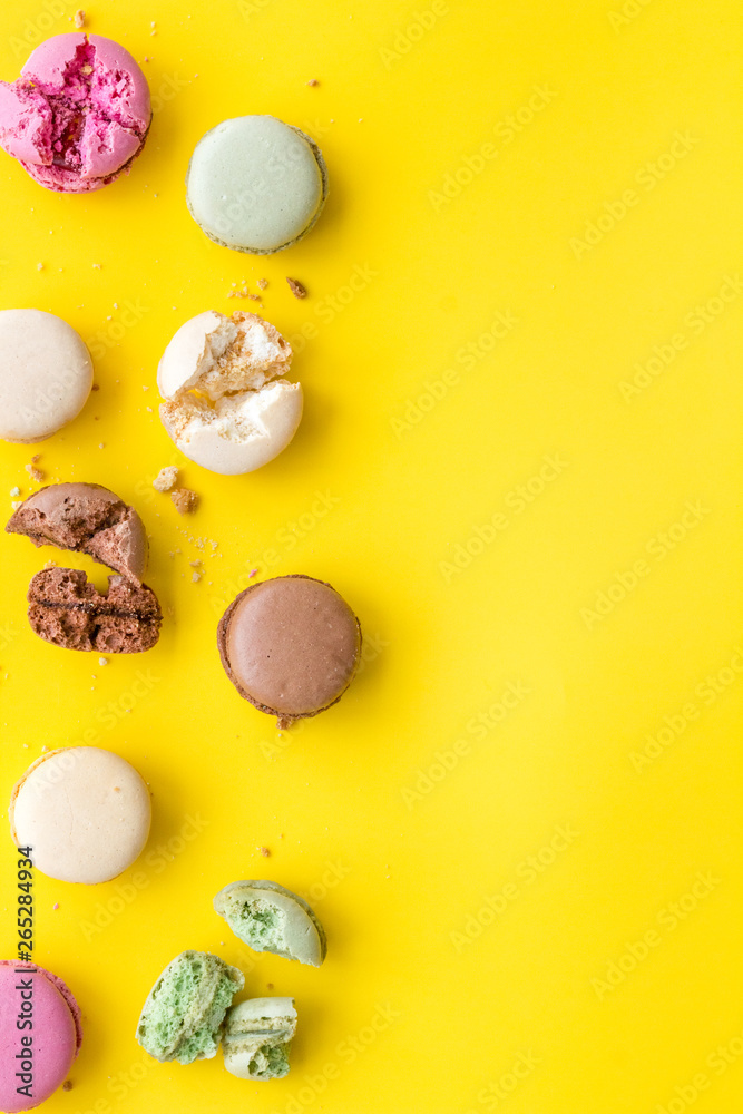 sweet dessert pattern with macarons on yellow background flat lay mockup