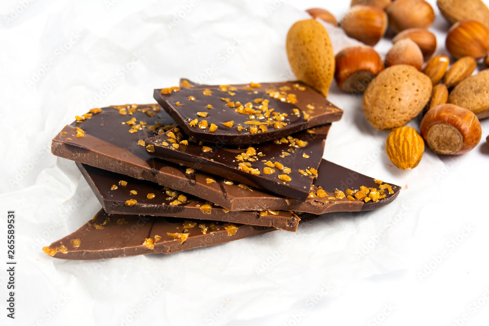 Chocolate with almonds on white background