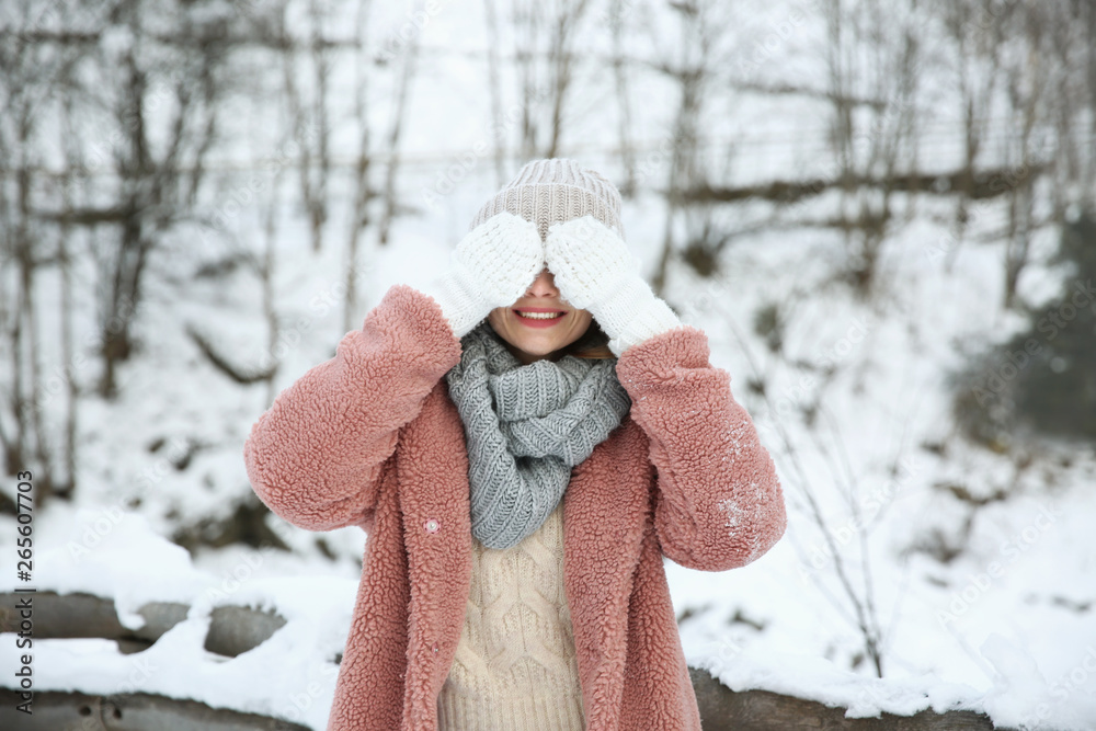 Happy woman at snowy resort