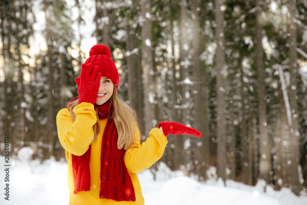 Beautiful young woman in winter forest