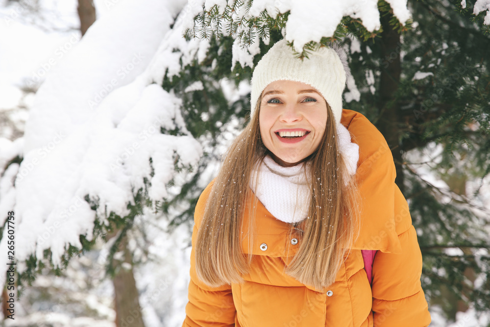 Beautiful woman in winter forest