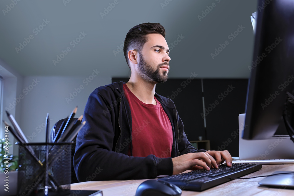 Male programmer working in office