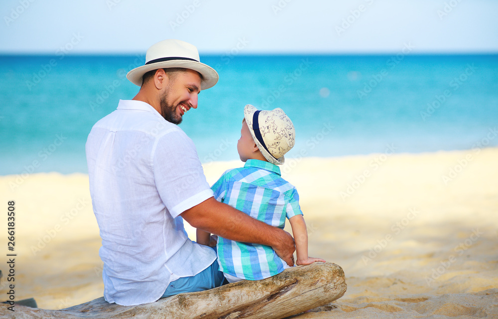 fathers day. Dad and baby son playing together outdoors on a summer .