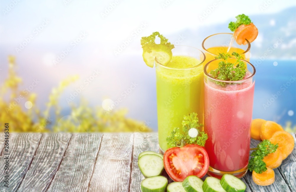 Healthy  vegetable juices on background