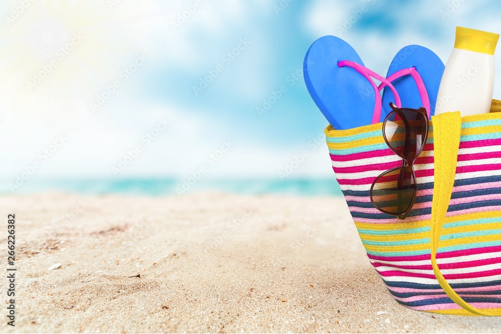 , bag, sunglasses  on a tropical beach