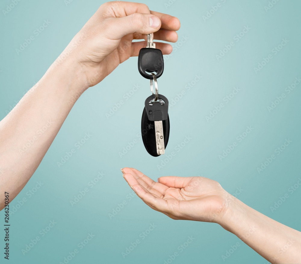 Key car key human hands designated driver concept car rental holding