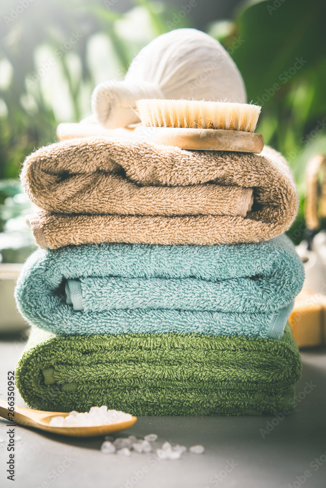 Towels on tropical leaves background, close up