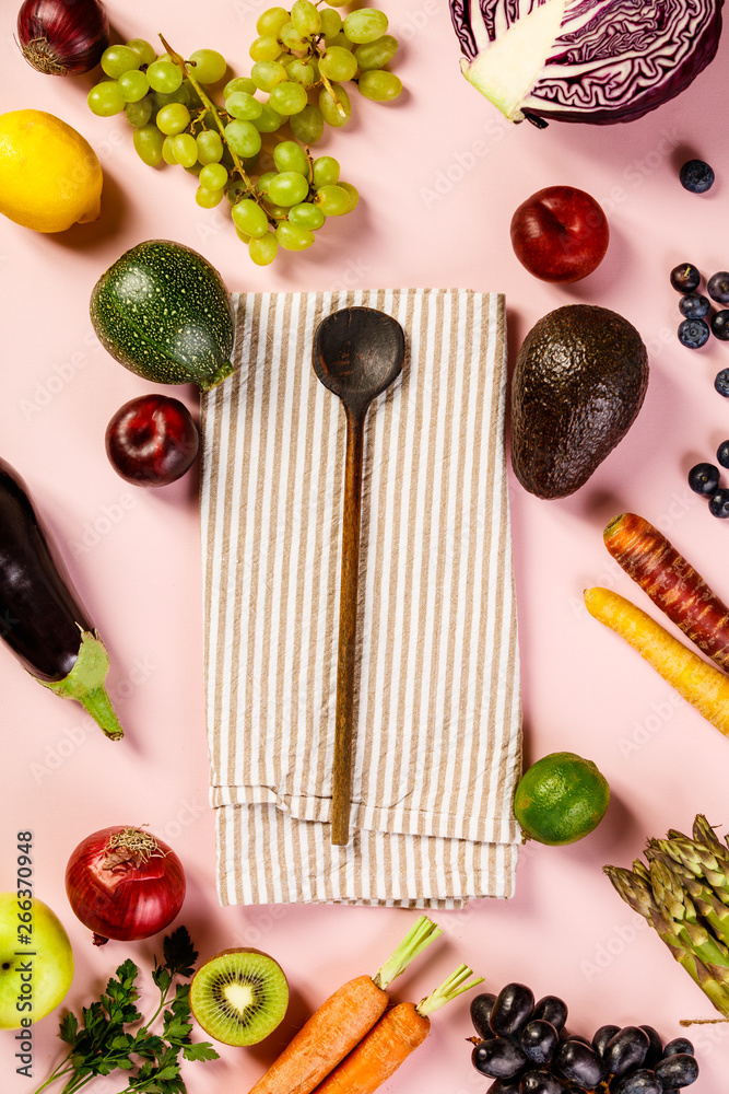 Fruits and vegetables on pink background, flat lay, top view