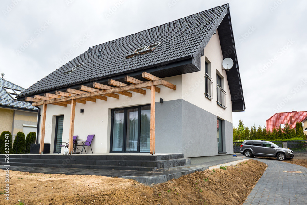 House with new laid concrete paver blocks