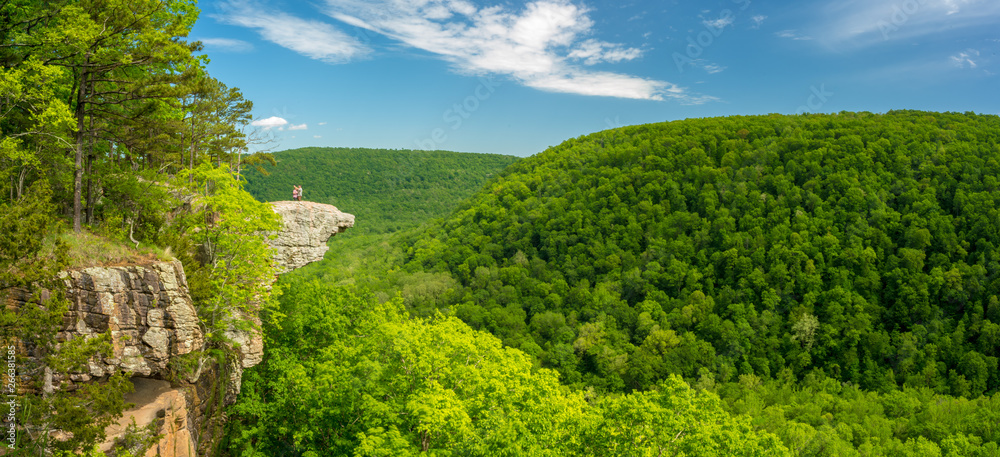 Tourist visitors couple taking pictures at Whitaker Point rock cliff hiking trail, landscape view, O